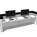 Modern Reception Desk with Two Monitors Keyboards and Mice on Black Edge Countertop