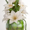 Glass Vases With White Lilies Roses And Green Decorative Elements On Wooden Surface