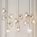 Modern Pendant Lights With Circular Glass Shades And Golden Metal Frames Illuminated