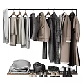 Fashionable Neutral Colored Clothes Hanging On Racks With Coats And Sweaters