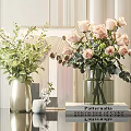 Elegant Glass and Gold Vases with Pink Roses Green Foliage and White Flowers on Table