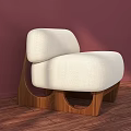Cream Fabric Single Sofa With Unique Wooden Legs Curved Design And Pink Wall Wooden Floor