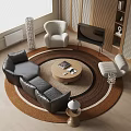 Black Curved Leather Sofa and Round Wooden Coffee Table with Magazines on Top