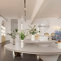 Modern Boutique Store Interior With Round White Table Vases Green Blue Flowers And Round Mirror