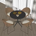 Stylish Round Table With Wicker Chairs Cushioned Seats And Fruit Bowls