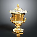 Golden Decorative Trophy With Ornate Lid Intricate Handles And Detailed Base