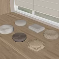 Various Round Square Floor Cushions On Wooden Window Platform With Woven Fabric