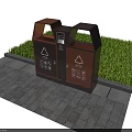 Outdoor Public Classified Trash Bins With Recycling Symbols On Stone Pavement Near Grass Area