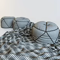 Three Soft Gray Round Ottoman Cushions With Plaid Fabric Cover Design