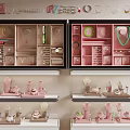 Stylish Jewelry Accessories Display in Pink Showcase with Layered Shelves and Organized Arrangement