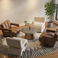 Modern Single Sofa Setup With Round Zebra Striped Rug Metal Coffee Table And Green Plant