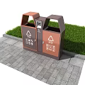 Public Recycling Facility With Brown And Orange Sorting Bins On Paved Ground Near Grass