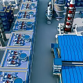 Industrial Factory Plant With Blue Roof Pipes Towers And Production Equipment