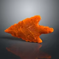 Orange Carved Sculpture In Arrowhead Shape On Gray Background With Reflection 3d model