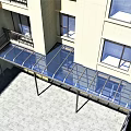 Sunshade Canopy With Metal Frame Over Building Windows And Stone Paved Ground In Residential Area