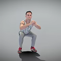 Man Squatting In Tank Top Gray Pants And Red Shoes With Tattoo On Gray Background