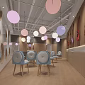 School Indoor Common Area With Wooden Benches Large Windows Pink White Hanging Lights