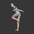 Woman Performing Graceful Dance Move In Blue Outfit Balancing On One Leg