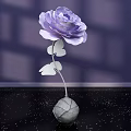 Floral Art Display Featuring Purple Paper Flower With Silver Stem And Gray Spherical Vase