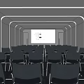 Spacious Lounge Area With Rows Of Chairs And Large Projection Screen