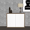 Modern Storage Cabinet with White Doors Brown Frame Table Lamp Vases and Wall Art