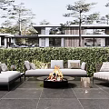 Modern Outdoor Sofa Set With Fire Pit And Lush Greenery In Patio Area