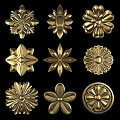 Various Golden Flower Shaped Decorative Ornaments Featuring Intricate Patterns 3d model