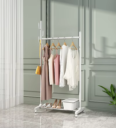 White Freestanding Clothes Rack With Hanging Pink White Beige Clothes Yellow Bag And Shoes 3d model