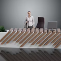 Modern Unique Office Desk With White Base Brown Slanted Stripes Black Chair Monitor And Green Plant