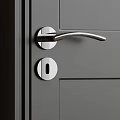 Modern Silver Metal Door Handle Installed On Gray Door With Keyhole
