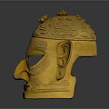 Intricate Golden Mask Sculpture With Detailed Carving Patterns And Decorative Top