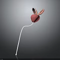 Decorative Pink Heart With Pink Wings On White Slender Stick Against Gray Background