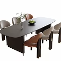 Modern Dark Oval Dining Table With Gray And Brown Chairs Green Plants And Fruit Bowl