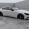 Modern White Coupe Car With Sleek Body And Black Wheels In Minimalist Indoor Space