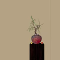 Red Vase With Flowering Branches On Dark Wooden Cabinet With Fruits Sunlight On White Wall