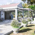 Traditional House Exterior With Red Roof White Walls Courtyard And Potted Plants