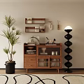 Wooden Storage Cabinet with Palm Plant Black Spiral Floor Lamp and Decorative Items