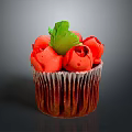 Colorful Cupcake With Red Rose Decorations And Green Leaf On Top
