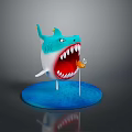 Cartoon Shark Figurine With Open Mouth Sharp Teeth And Small Flag On Blue Circular Base