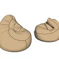 Two Beige Comfortable Rounded Fabric Bean Bag Chairs for Home Use