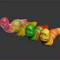 Colorful Gummy Worms With Red Yellow Green Smiley Face Shapes On Black Surface