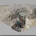 Ancient Stone Masonry Entrance With Stacked Stone Walls Earthen Top and Sparse Vegetation