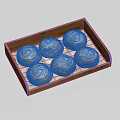 Six fresh homemade cinnamon rolls with powdered sugar displayed in wooden tray