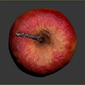 Shiny Juicy Red and Orange Apple with Stem on Dark Background