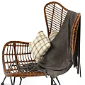 Wicker Lounge Chair With Plaid Pillow And Linen Blanket On Black Metal Frame