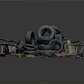 Used Automotive Car Tires Stacked On Metal Pallet With Dry Leaves