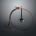 Vintage High Wheel Bicycle With Large Front Wheel Small Rear Wheel And Red Seat