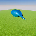 Blue Whale Shaped Garden Ornament On Lush Green Grass Under Clear Blue Sky