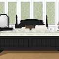 Black Double Bed in Green Patterned Wallpaper Background with Striped Bedspread Nightstands Lamp Mirror