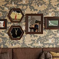 Abstract Paintings In Framed Artworks On Patterned Wallpaper Living Room With Brown Sofa And Cushions